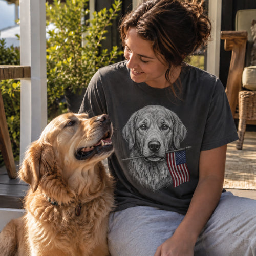 Woman wearing a golden retriever American flag T-shirt beside her dog